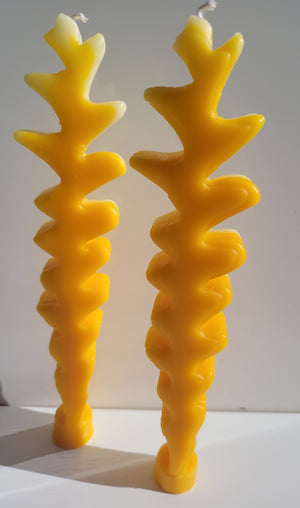 Pair of beautiful Wiggly Butter Candles. Yellow gradient is different for each candle